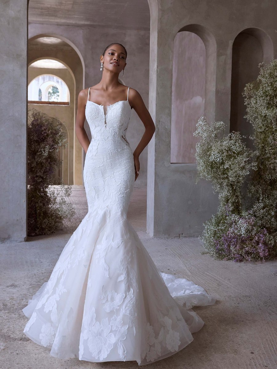 Floral lace mermaid gown in a vaulted stone arcade
